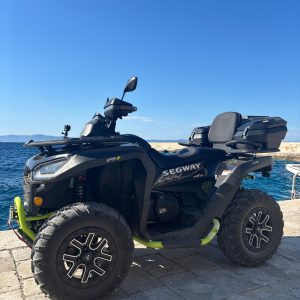Quad bikes parked on a coastal road above the sea on Korčula